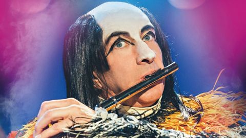 Brian Pern playing a flute on the cover of his DVD