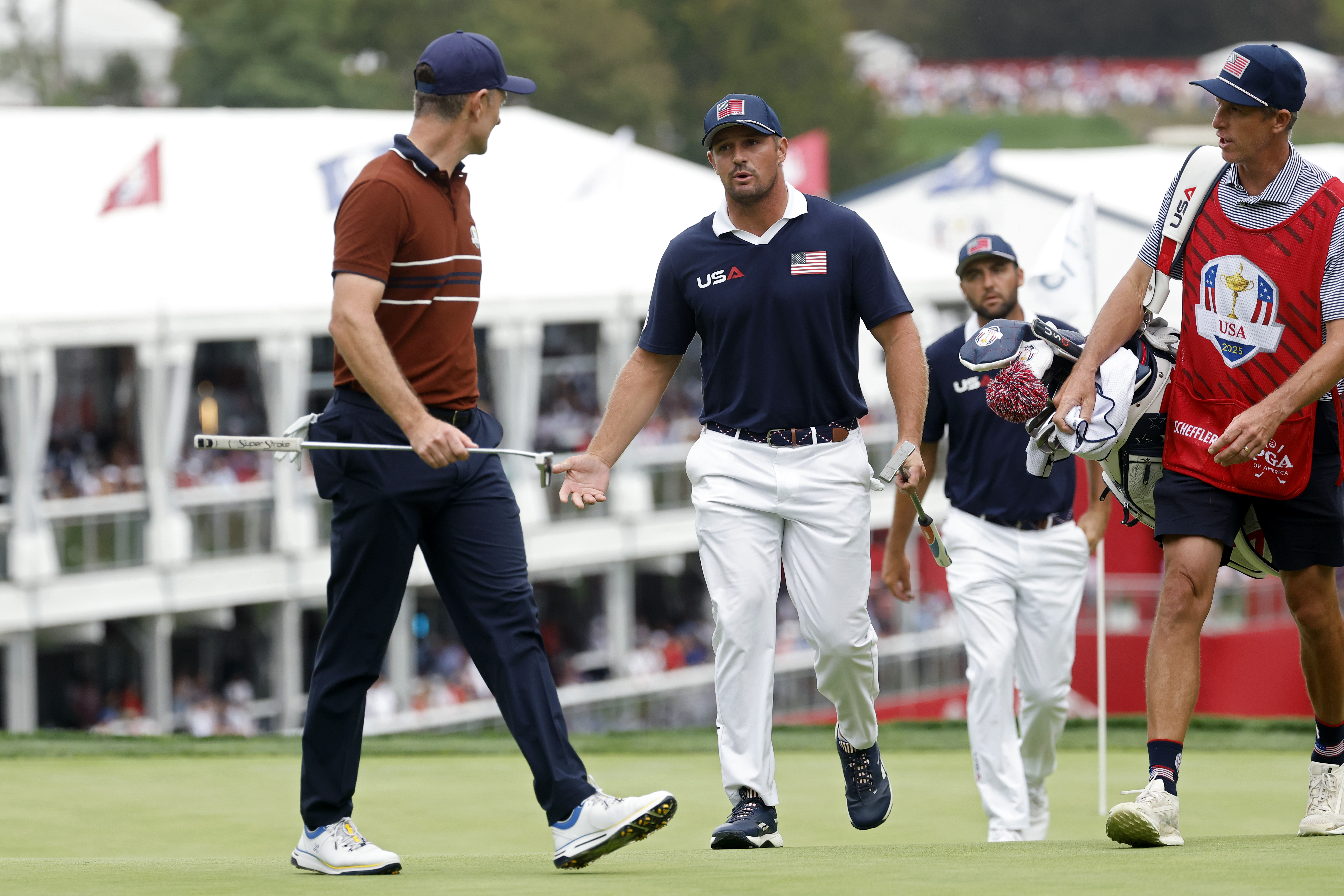 Justin Rose and Bryson DeChambeau argue over the green
