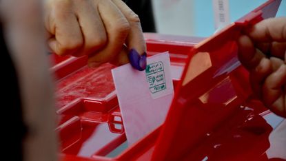 A Tunisian man casts his vote