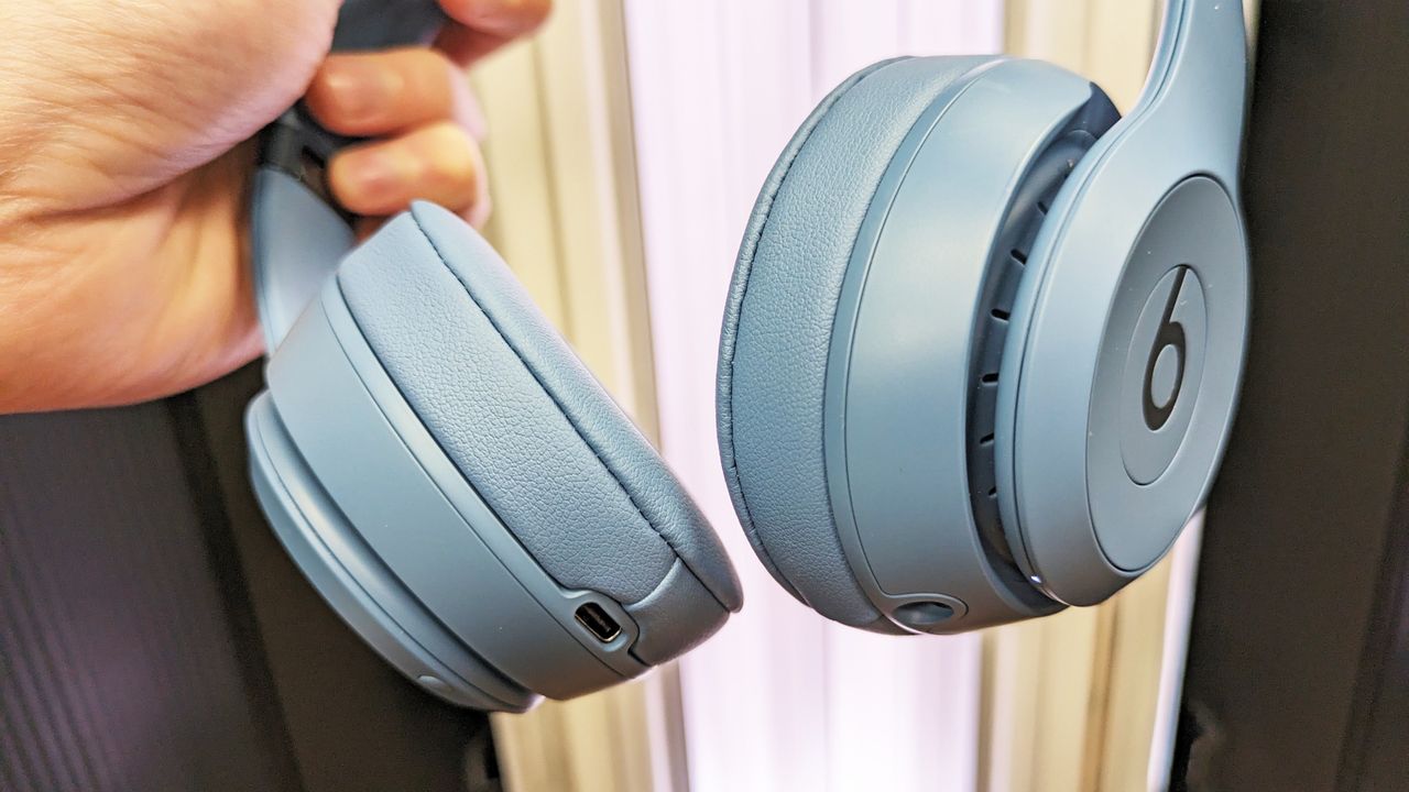 Beats Solo 4 held in hand