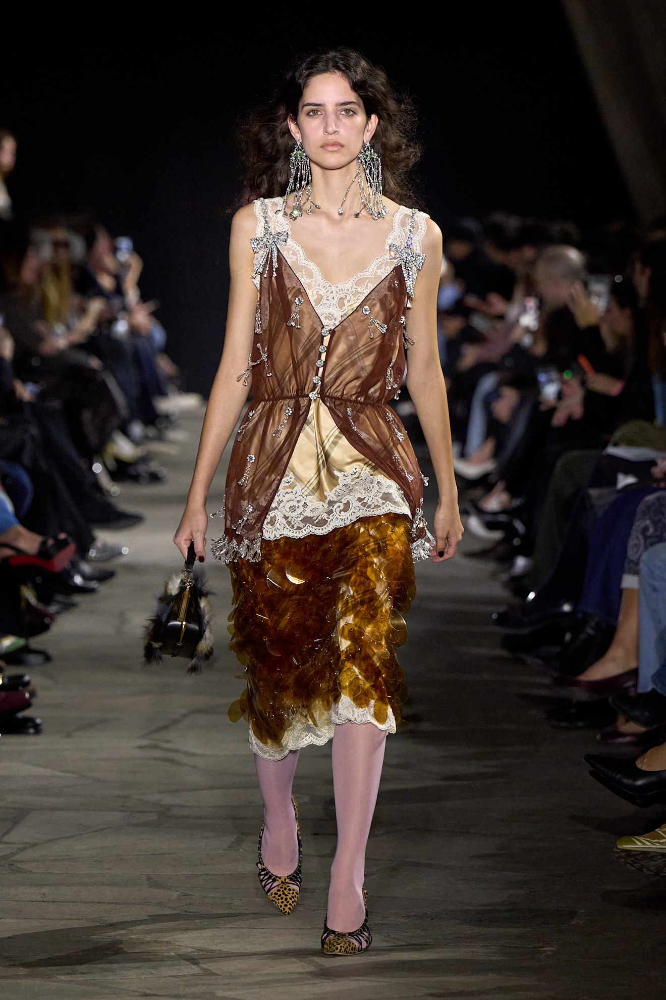 Woman in an opulent evening outfit.