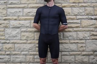 Image shows a rider wearing the Castelli Sanremo 4.1 skinsuit.