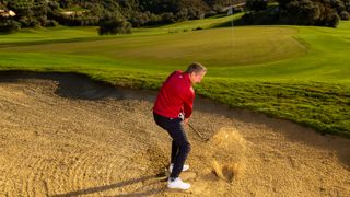 Anders Mankert demonstrates a greenside bunker shot