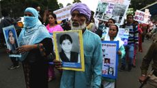 Relatives of those killed in the disaster hold a commemoration rally in Bhopal in 2014