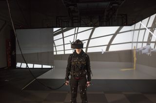 A large motion-tracked area for collaboration using head-mounted displays (HMDs) is connected in real time to a large-scale CAVE system at the National Institute for Aviation Research (NIAR) at Wichita State University.