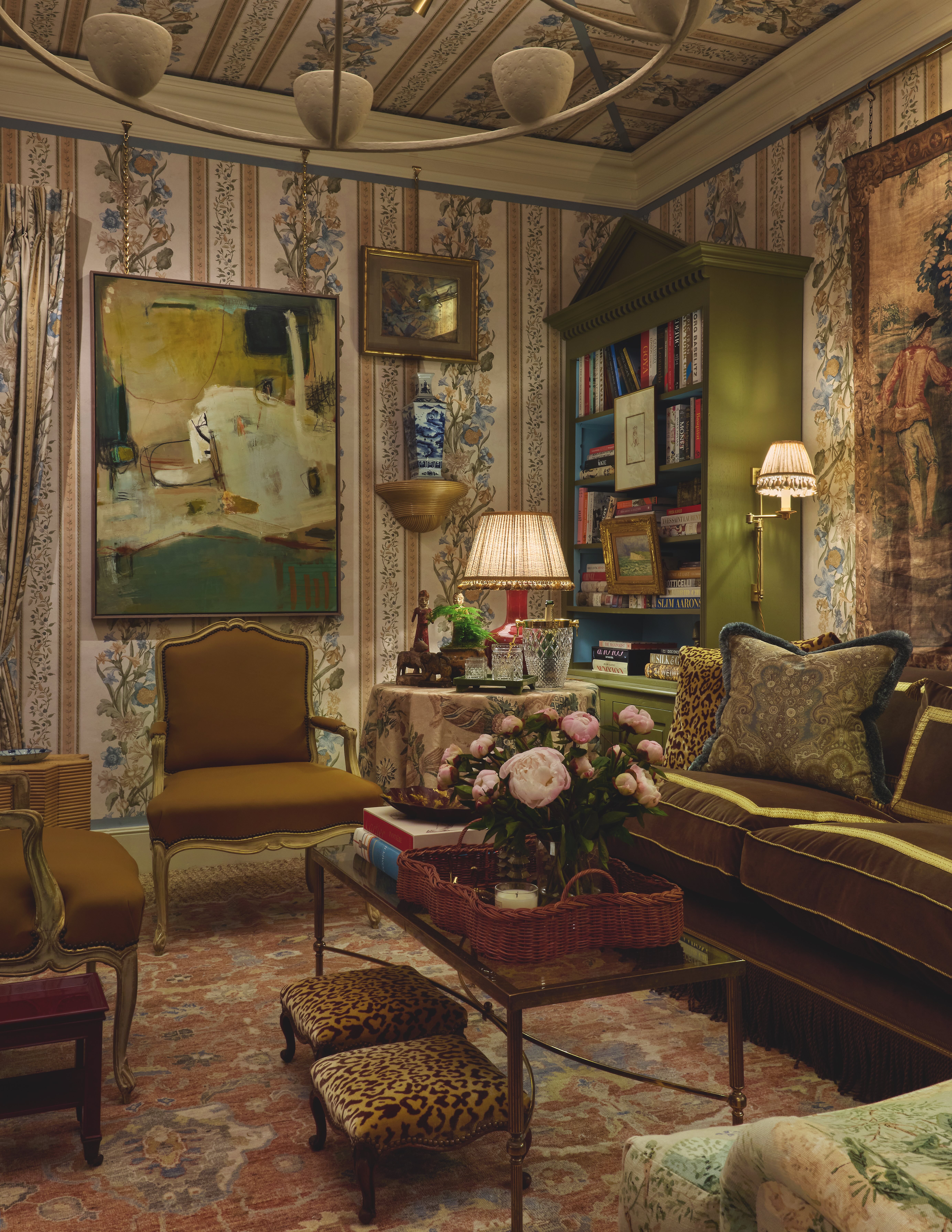 A green wallpapered drawing room