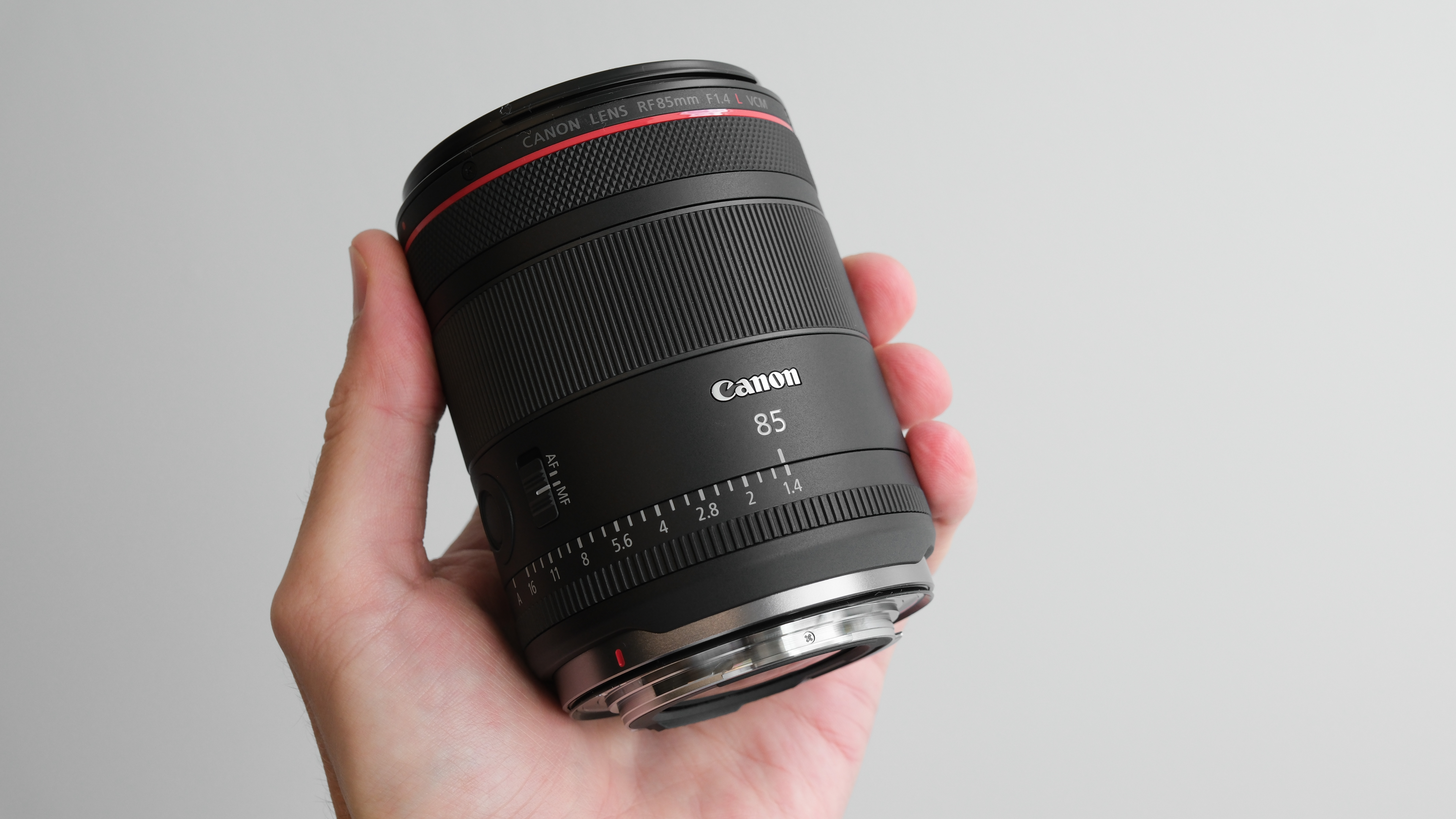 Canon RF 85mm f/1.4L VCM held in hand