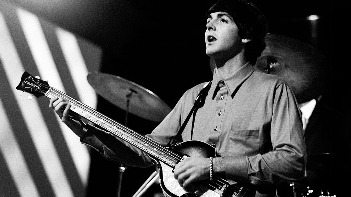 paul mccartney playing guitar