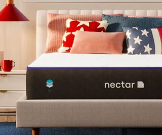 a Nectar original mattress decorated with stars and stripes pillows
