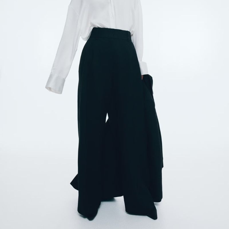 Wide linen-blend trousers on model 