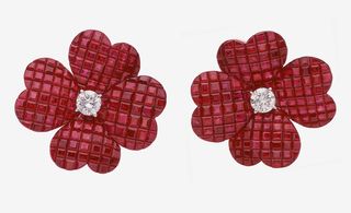 These Van Cleef & Arpels Mini Cosmos Earrings are a perfect example of the mystery setting technique made famous by the house