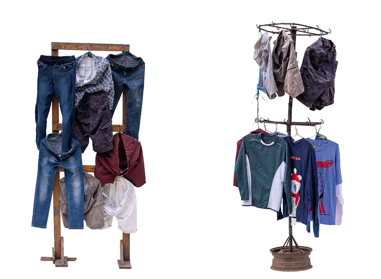 Okrika stalls with clothes, shown on a white background