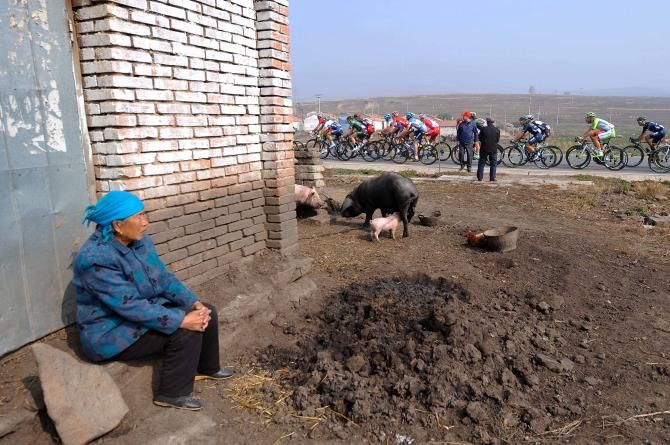 The locals watch the peloton pass