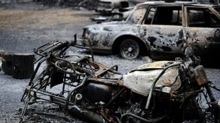 Burned vehicles left behind after the wildfires had passed.