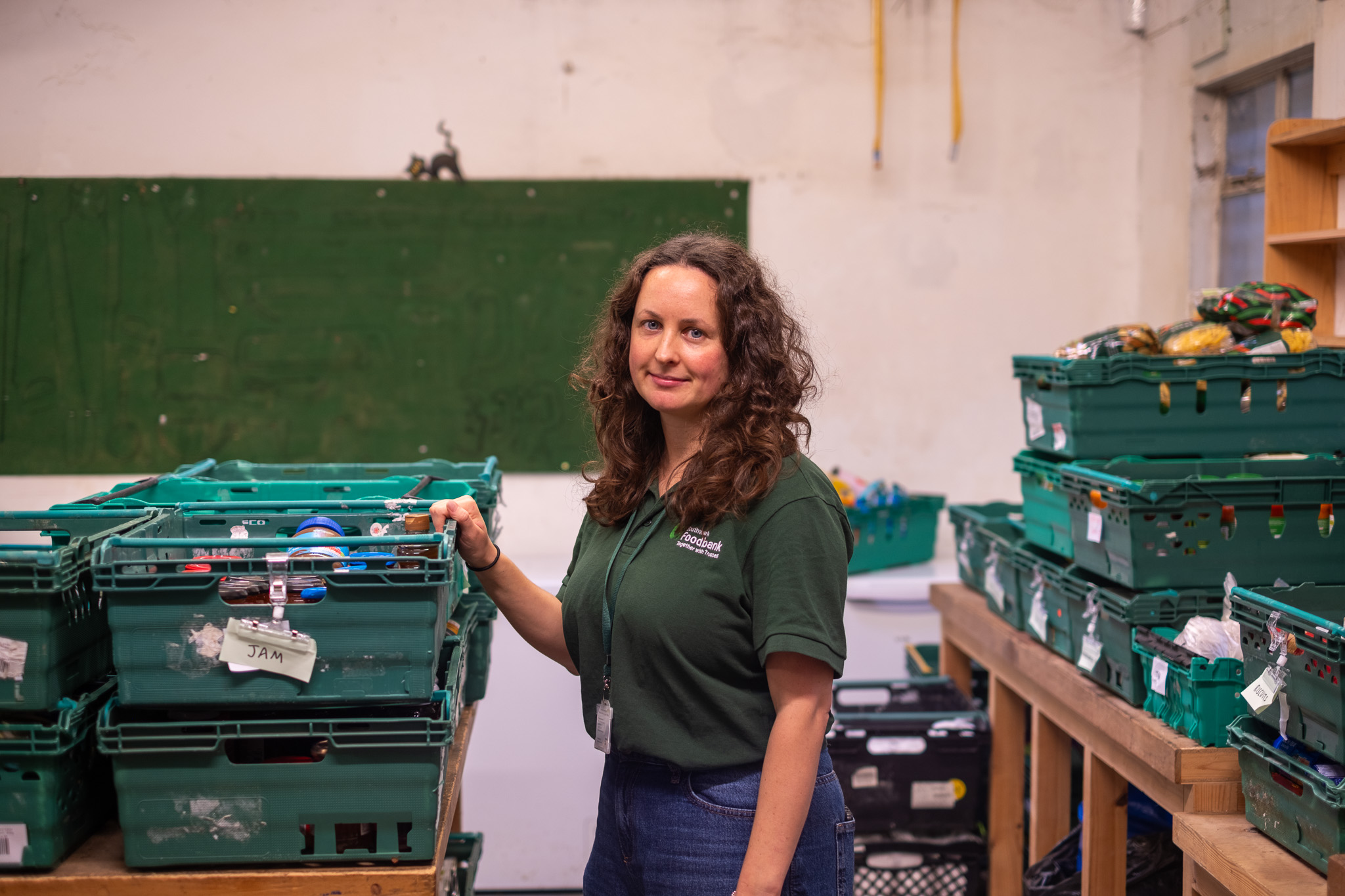 Emily Monaghan-Coombs, Pecan&amp;rsquo;s foodbank projects development manager, pictured by food parcels in the Southwark Foodbank warehouse.
