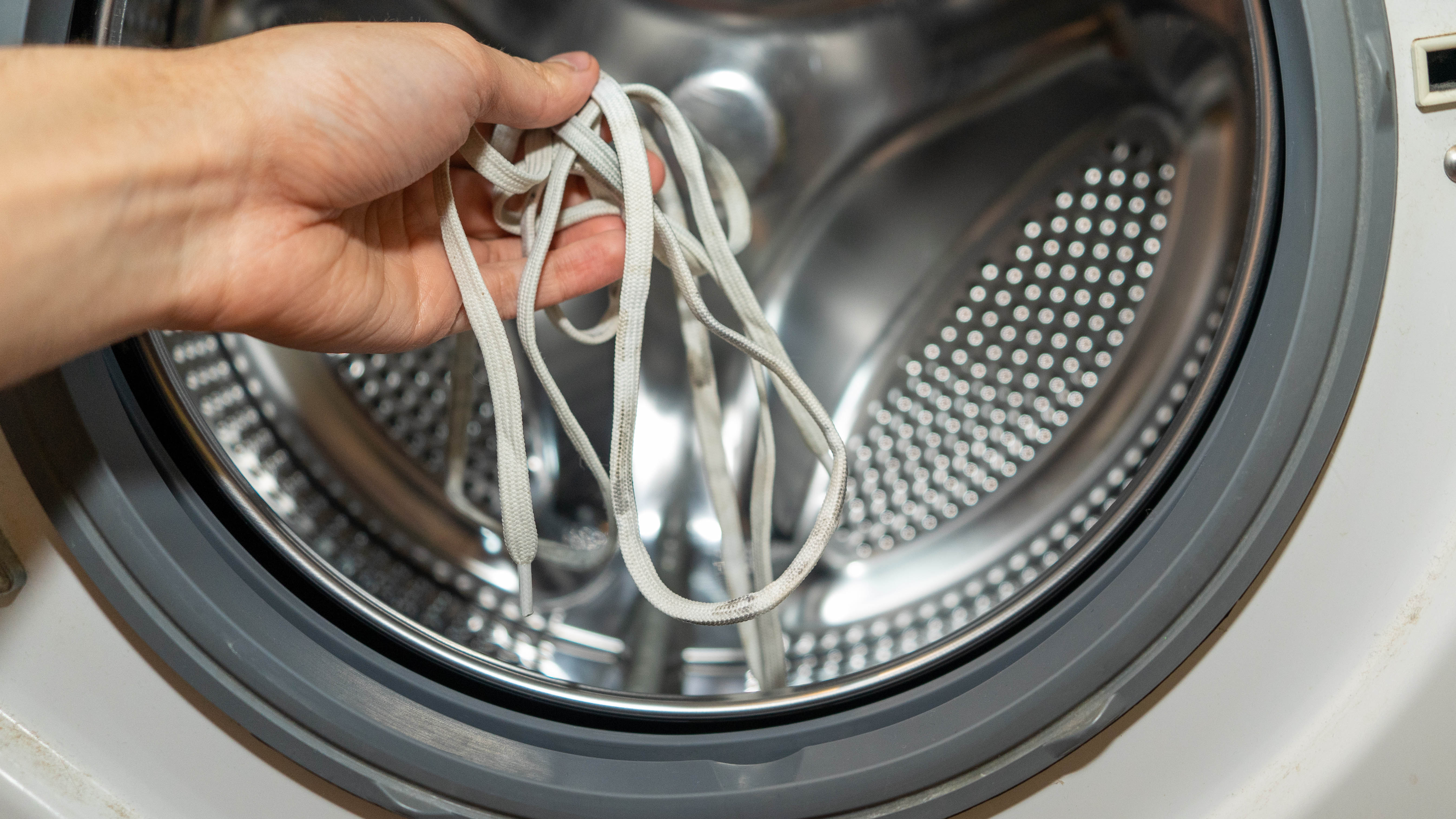 Put shoelaces in the washing machine