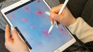Woman drawing on iPad Air with Apple Pencil