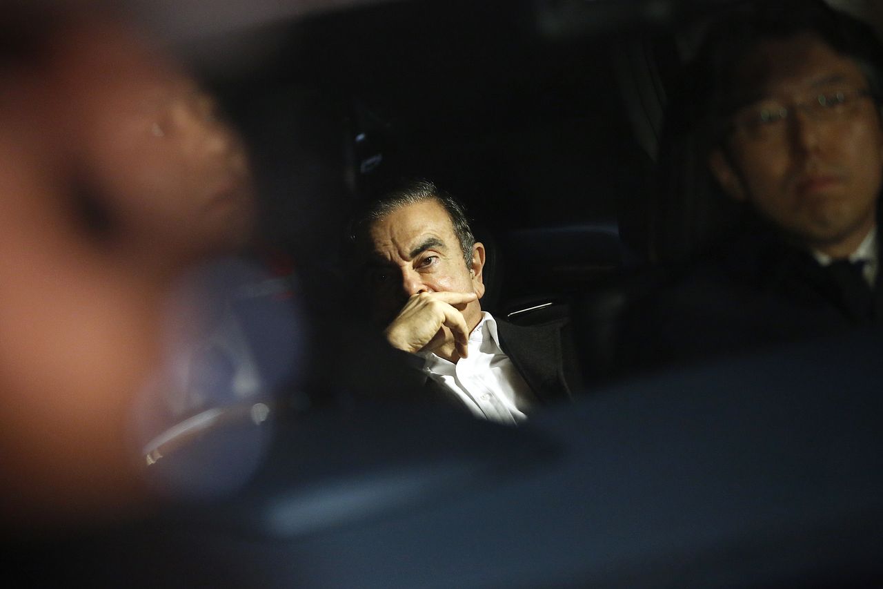 Bloomberg Best of the Year 2019: Carlos Ghosn, former chairman of Nissan Motor Co., center, sits in a vehicle as he leaves his lawyer&amp;#039;s office in Tokyo, Japan, on Wednesday, March 6, 2019. Ph