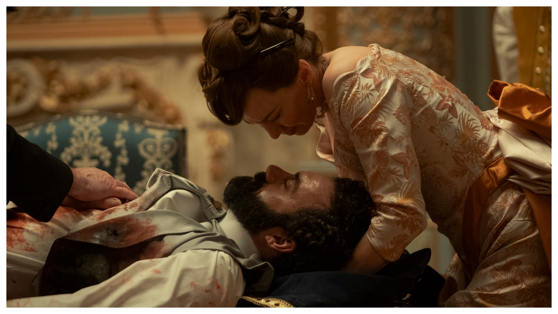 george russell bloodied and laying under bertha russell in a still from the gilded age season 3 finale