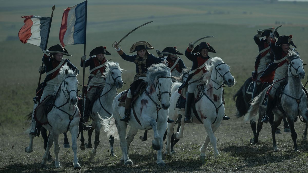 A still from Ridley Scott&#039;s Napoleon film, with horses charging into battle.