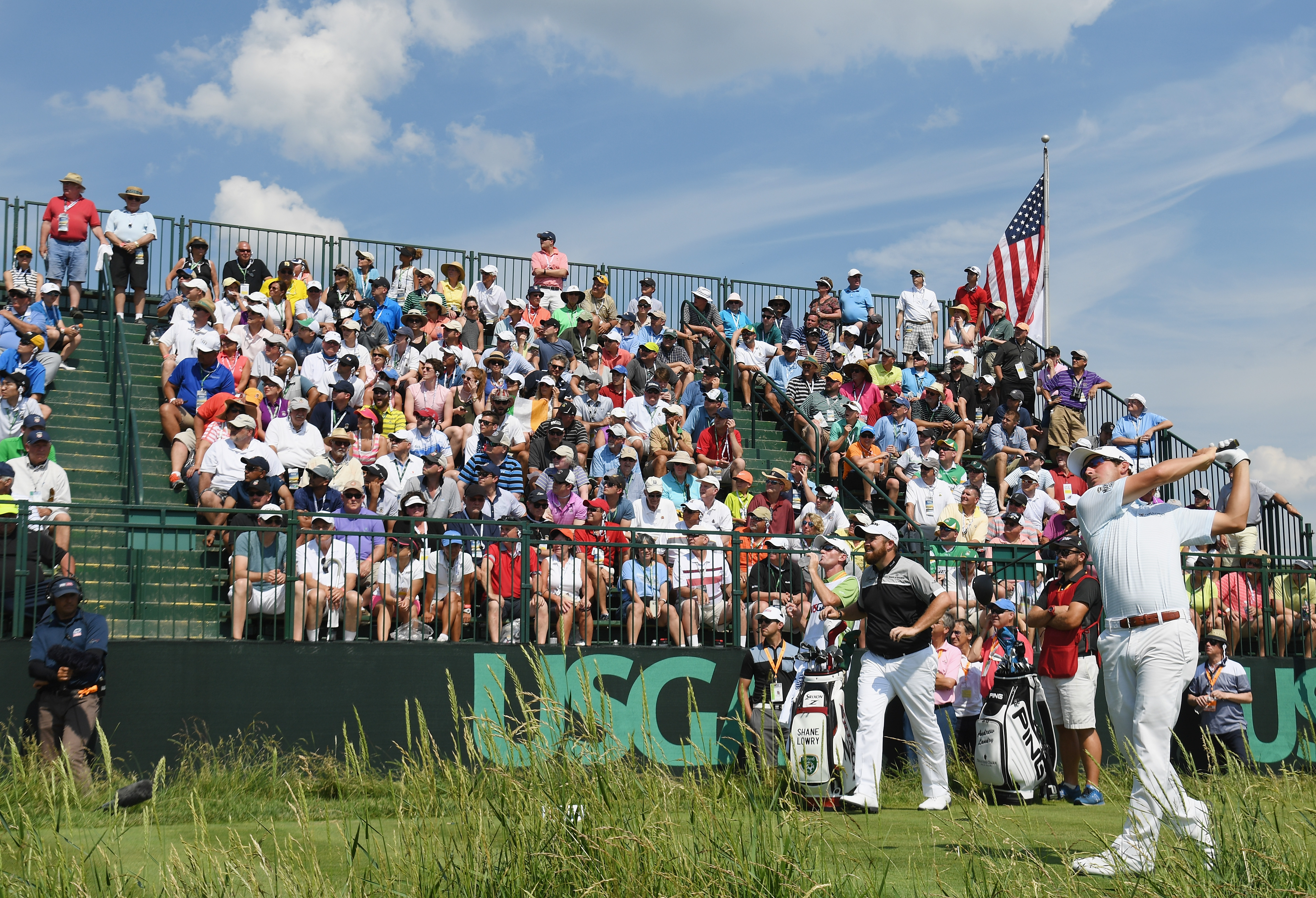 Andrew Landry tees off at the 2016 US Open with a large gallery in the background