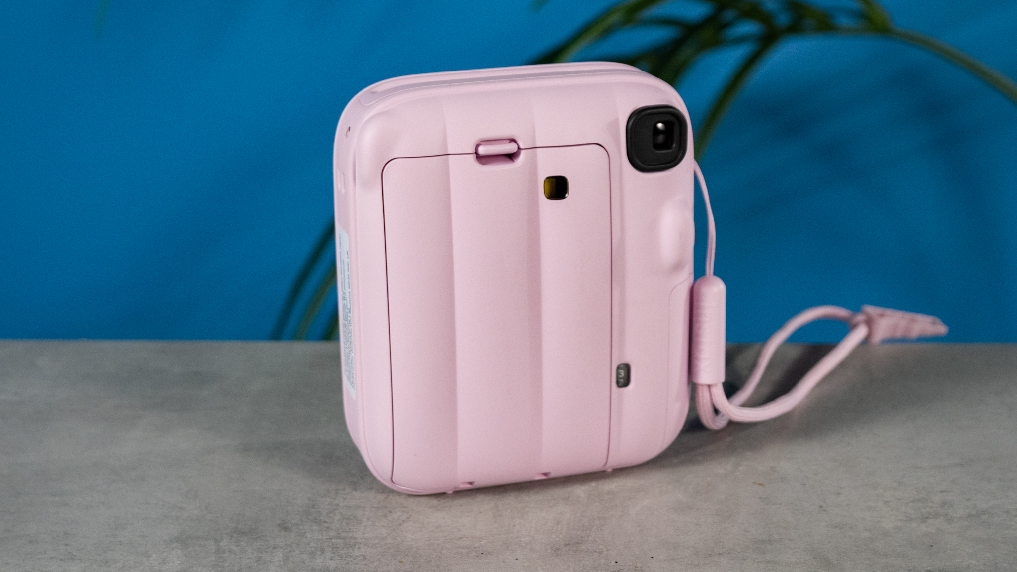 A Candy Pink Fujifilm Instax mini 13 instant camera