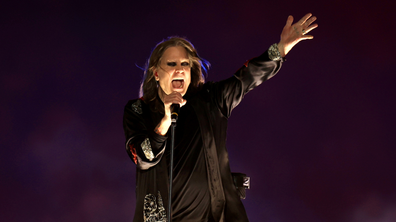Ozzy Osbourne singing on stage in 2022