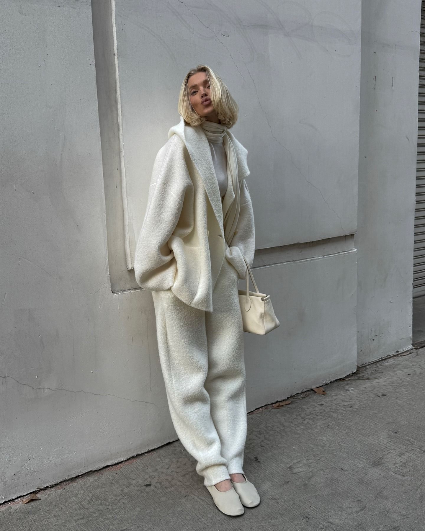 Elsa Hosk posing in a cream outfit with an ashy blonde bob