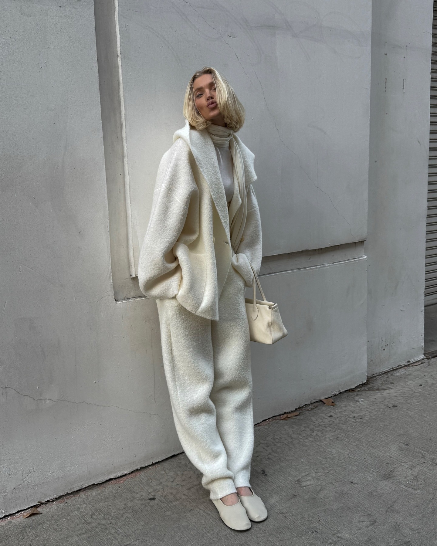 Elsa Hosk posing in a cream outfit with an ashy blonde bob