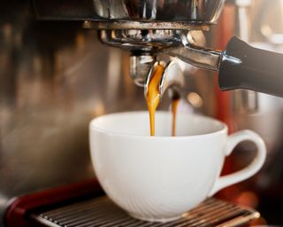 An espresso machine in action