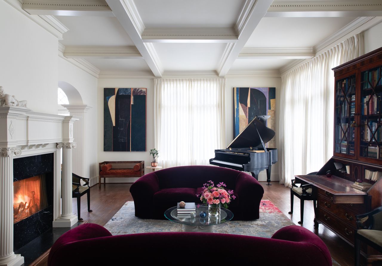 formal living room with burgundy sofas