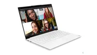 Lenovo Yoga Slim 7i Carbon lightweight laptop shown in white colorway, on the screen a video call is shown with four women, one of them wears glasses and all four smile