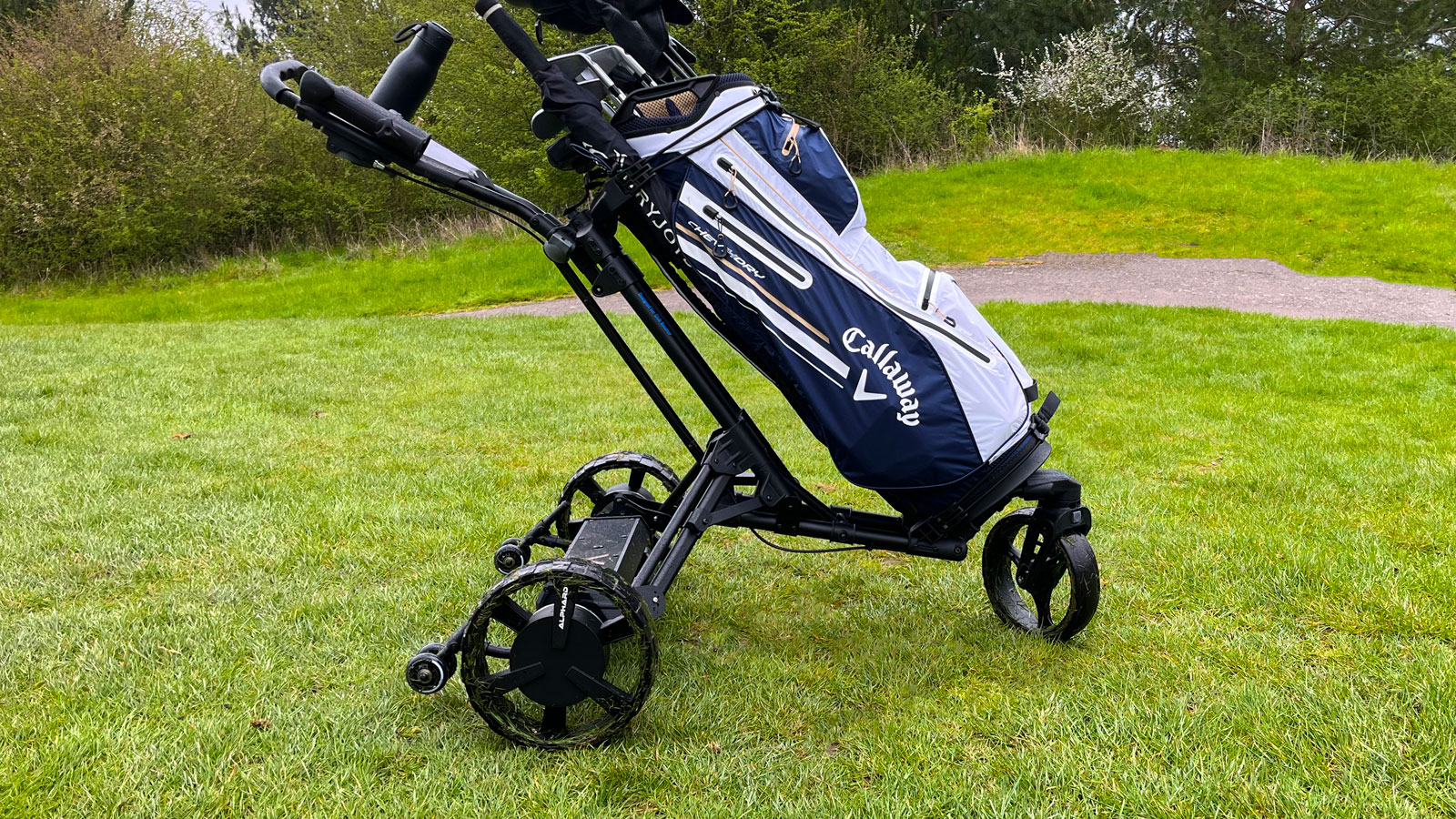 The Alphard Club Booster V2 on the golf course attached to the Alphard Omnicart