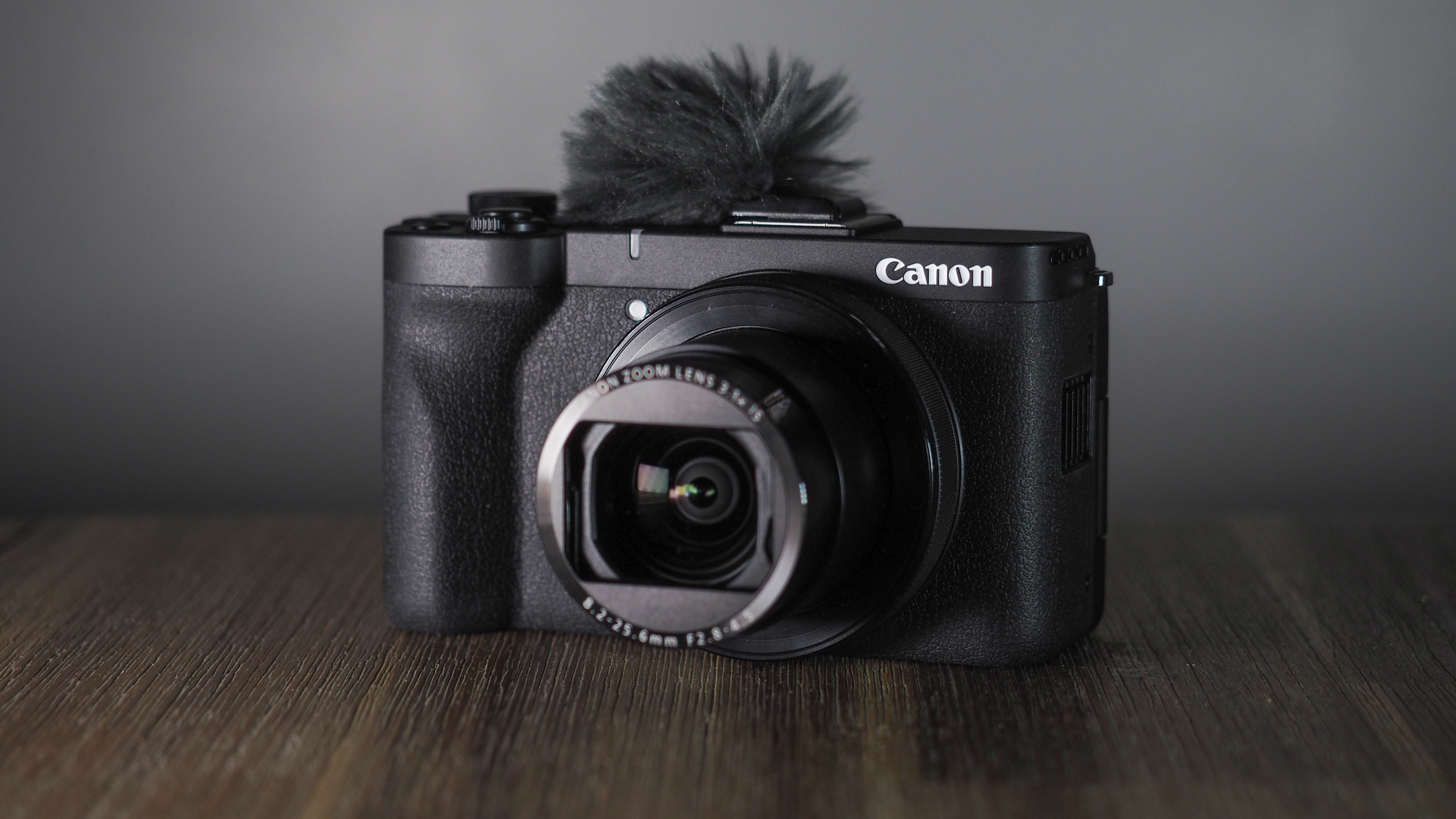 Canon PowerShot V1 on a wooden surface