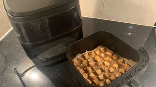 Dreo 6-Quart air fryer with tofu inside the tray