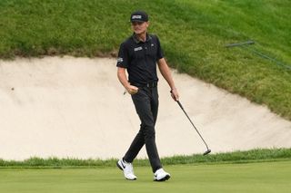 Luke Clanton fist pumps after holing a birdie putt at the John Deere Classic