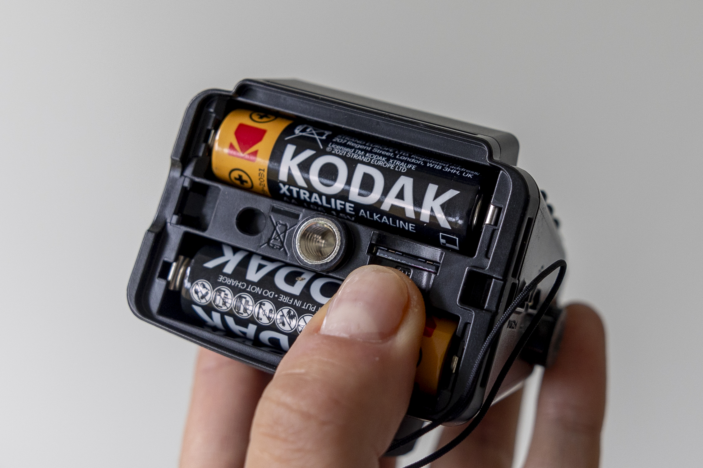 A close-up view of the battery and card slot on the Zoom Q2n-4k