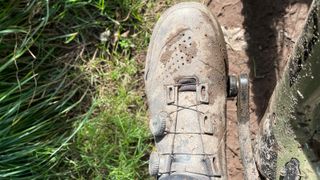 A muddy Fox Union BOA Flat shoe seen from above