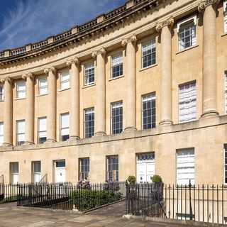 exterior with royal crescent and pillar-laden facade with family home