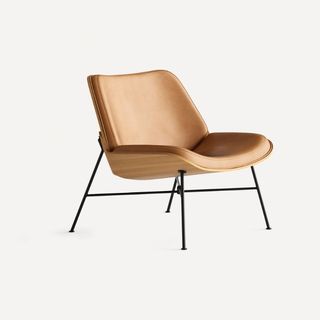 A camel brown leather Burrow lounge chair for w&h's sustainable furniture brands.
