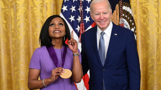 US President Joe Biden awards actress Mindy Kaling with the 2021 National Medal of Arts during a ceremony in the East Room of the White House in Washington, DC, March 21, 2023