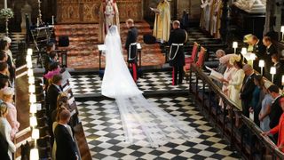 Prince Harry and Meghan Markle stand at the altar at St George's Chapel