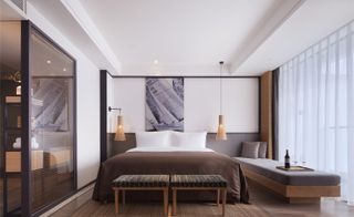 Bedroomsspaces are dressed in handsome, textured fabrics, bamboo accessories