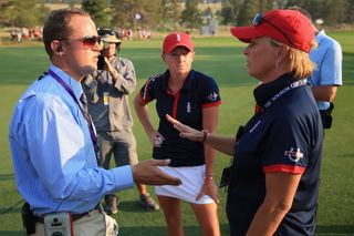 Stacy Lewis and Dottie Pepper discuss a ruling with an official at the 2013 Solheim Cup