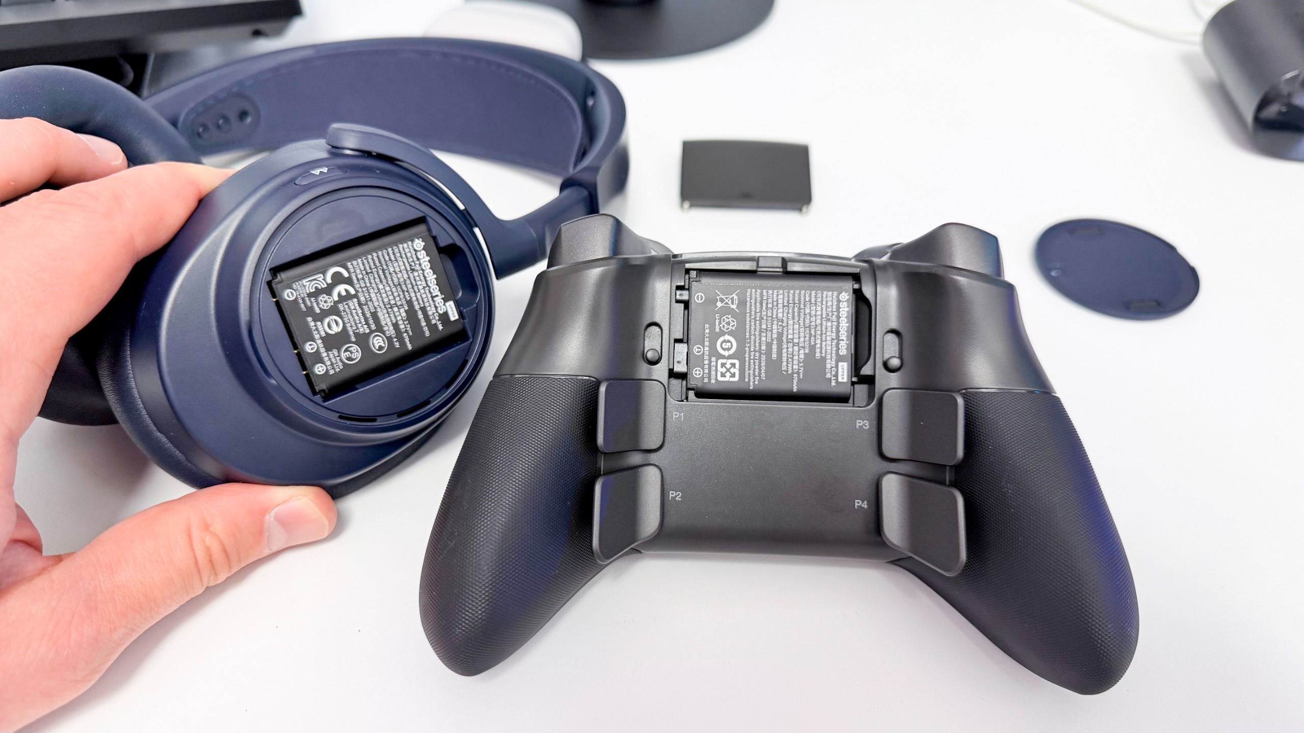 The SteelSeries Aeon Pro on a stone surface against a blue background