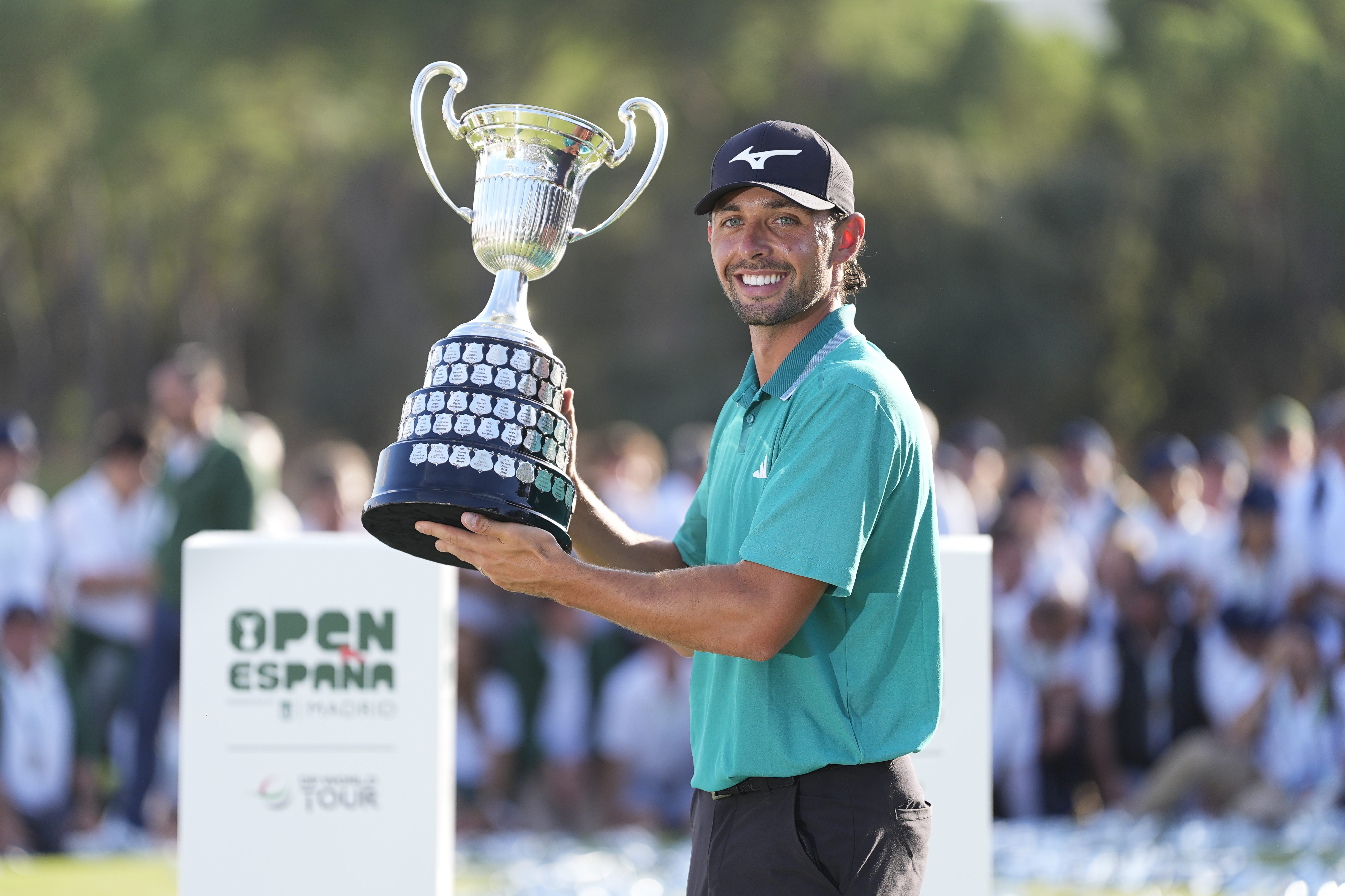 Marco Penge poses with the Spanish Open trophy after winning at Club de Campo Villa de Madrid