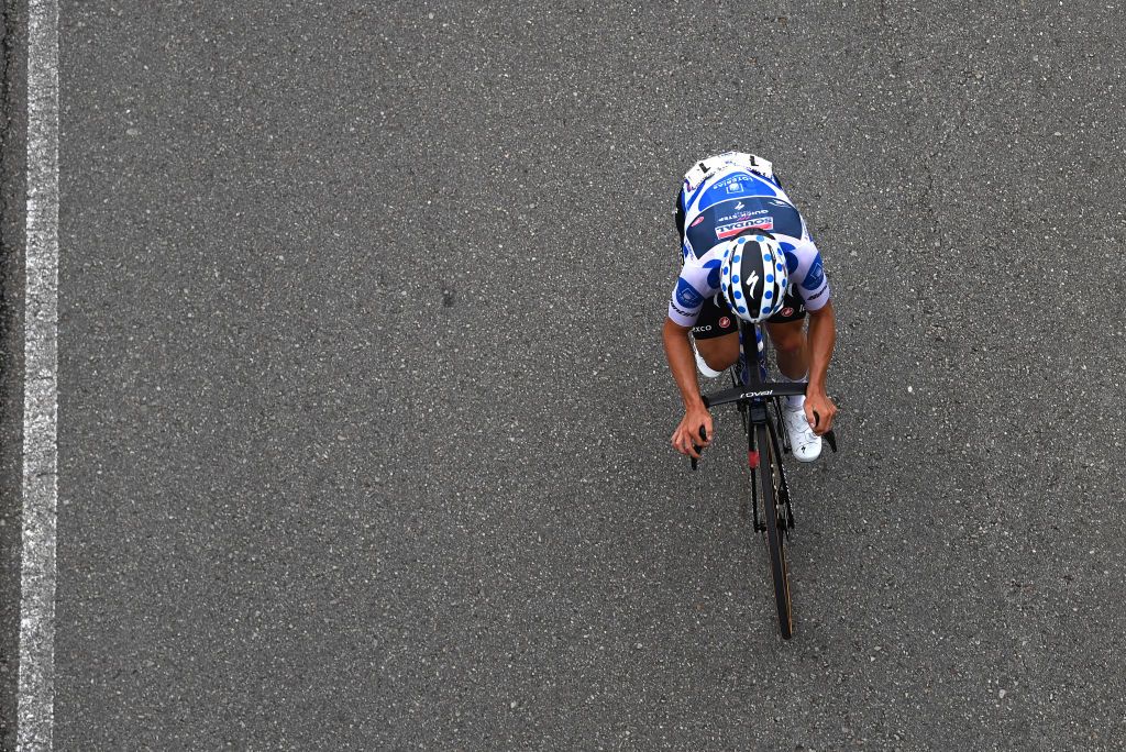 ALTU DE LANGLIRU SPAIN SEPTEMBER 13 Remco Evenepoel of Belgium and Team Soudal Quick Step Polka Dot Mountain Jersey competes in the breakaway during the 78th Tour of Spain 2023 Stage 17 a 1244km stage from Ribadesella Ribeseya to Altu de LAngliru 1555m UCIWT on September 13 2023 in Altu de LAngliru Spain Photo by Tim de WaeleGetty Images