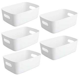 set of five white plastic storage baskets with handles