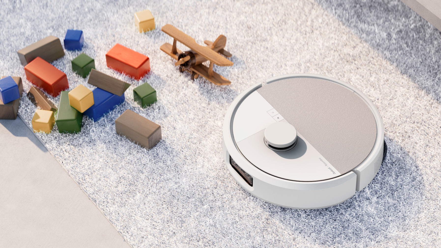 Roomba next to some toys