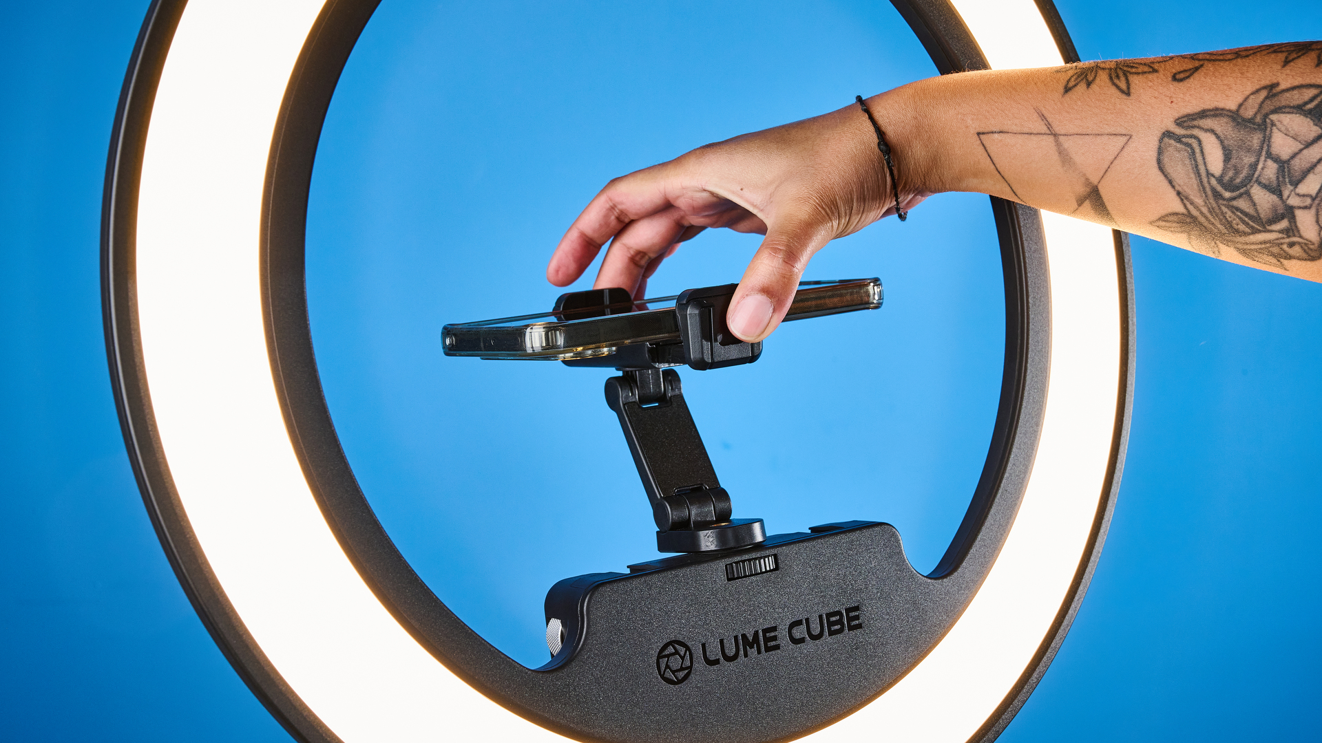 Lume Cube Cordless Ring Light Pro photographed in front of a blue background